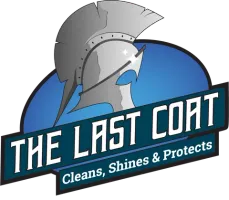 The Last Coat logo featuring a gray helmet with blue banner and text